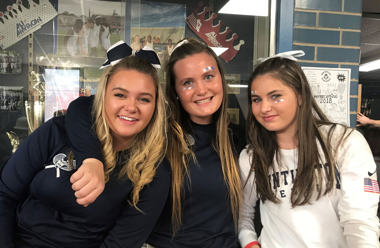 Mia Breitbarth (right) with tennis teammates Maire Brown and Christie Baade.