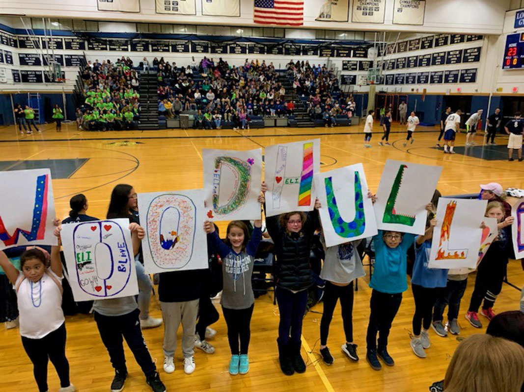 The Woodhull School team has some enthusiastic cheerleaders whipping the crowd into a frenzy.