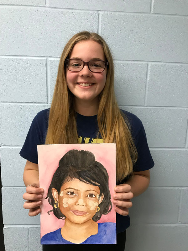 Huntington High School Art Honor Society members created portraits for the Memory Project.