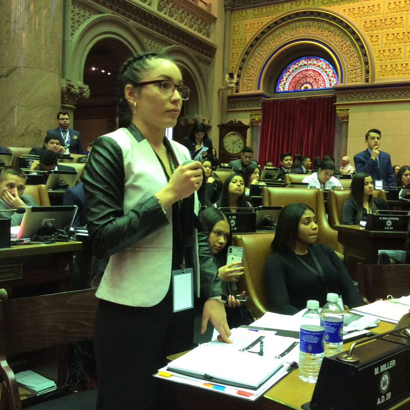 Huntington senior Ilsi Martinez Euceda debating a bill on the floor of the State Assembly.
