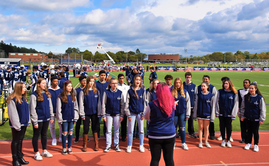 The Huntington chamber choir performed at last October's Homecoming Day football game.
