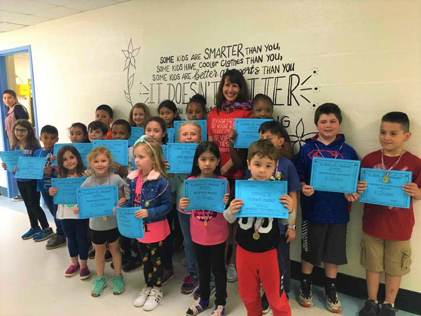 Principal Lucia Laguarda with Flower Hill School's April Star Student Award recipients.