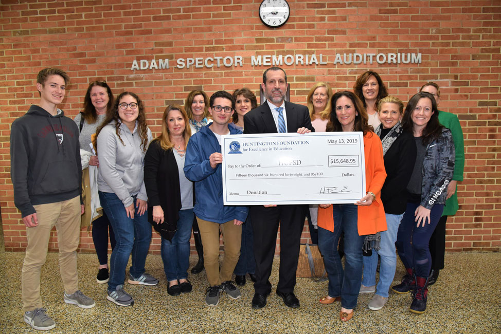   Superintendent Jim Polansky joined Huntington Foundation members during a check presentation ceremony on Monday night. 