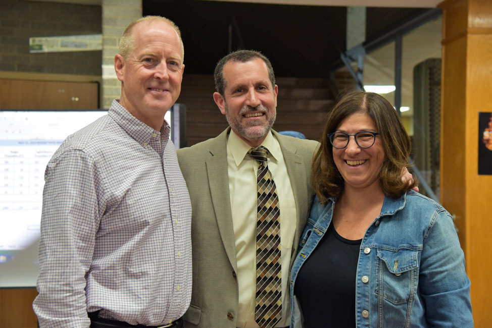Huntington Superintendent James Polansky is flanked by winning trustee candidates Bill Dwyer and Michele Kustera.