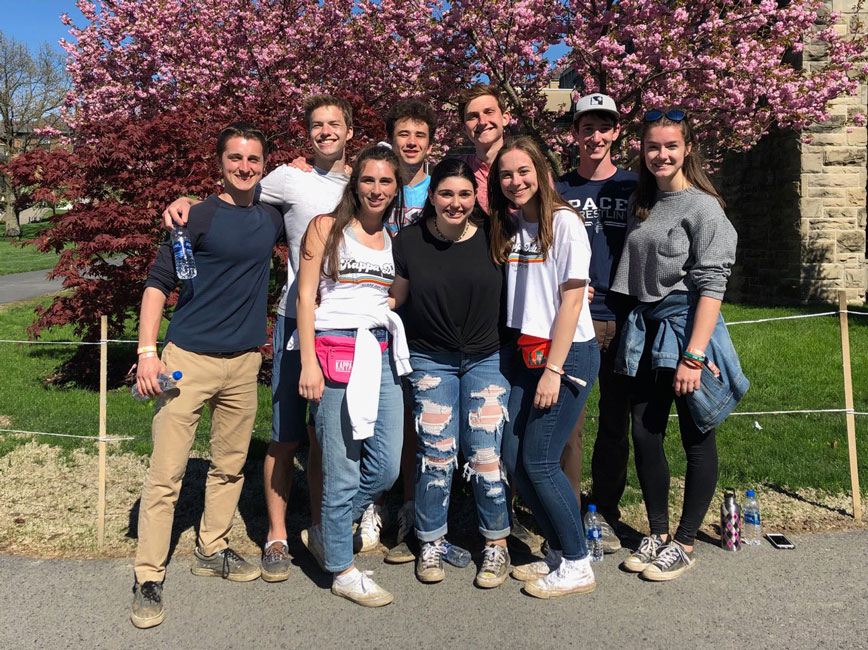 Huntington alum (front row center in black shirt) with friends on the Cornell University campus.