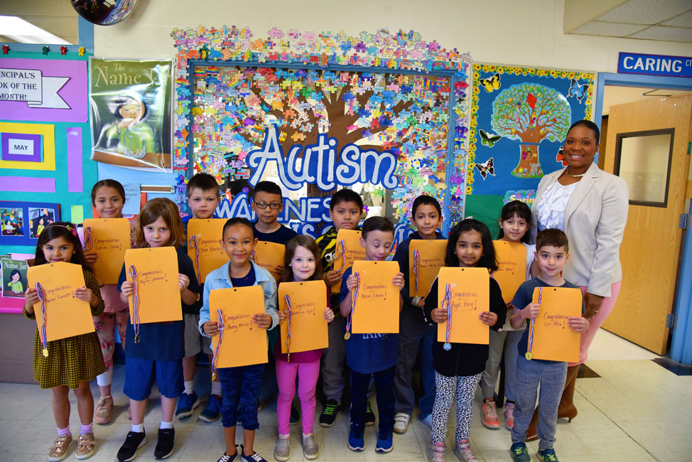 Washington Principal Michelle Richards with May's Featured Artists of the Month