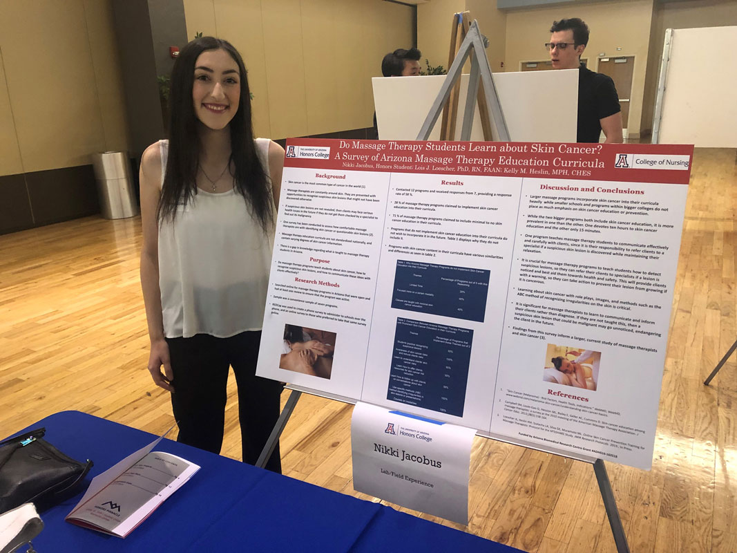 Nikki Jacobus with her research findings presentation board at the Univ. of Arizona.