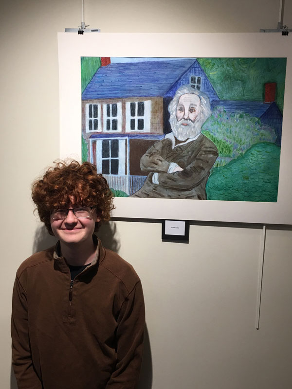 Nick Rowley stands near his artwork at the opening reception of the Walt Whitman exhibition last Friday night.