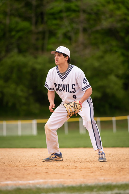 Jonah Anastos concentrates on the ball at first base for Huntington. (Darin Reed photo.)
