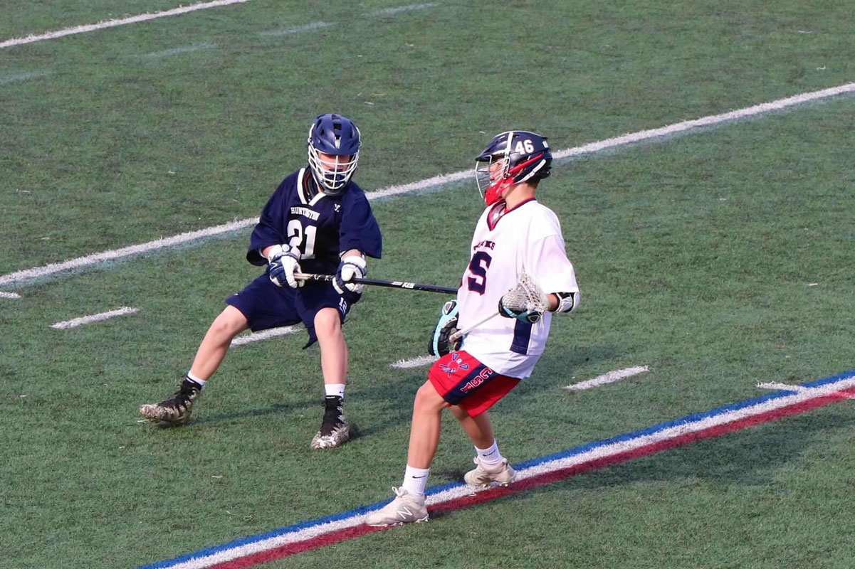 Harrison Krywak (left) goes one on one for Huntington.
