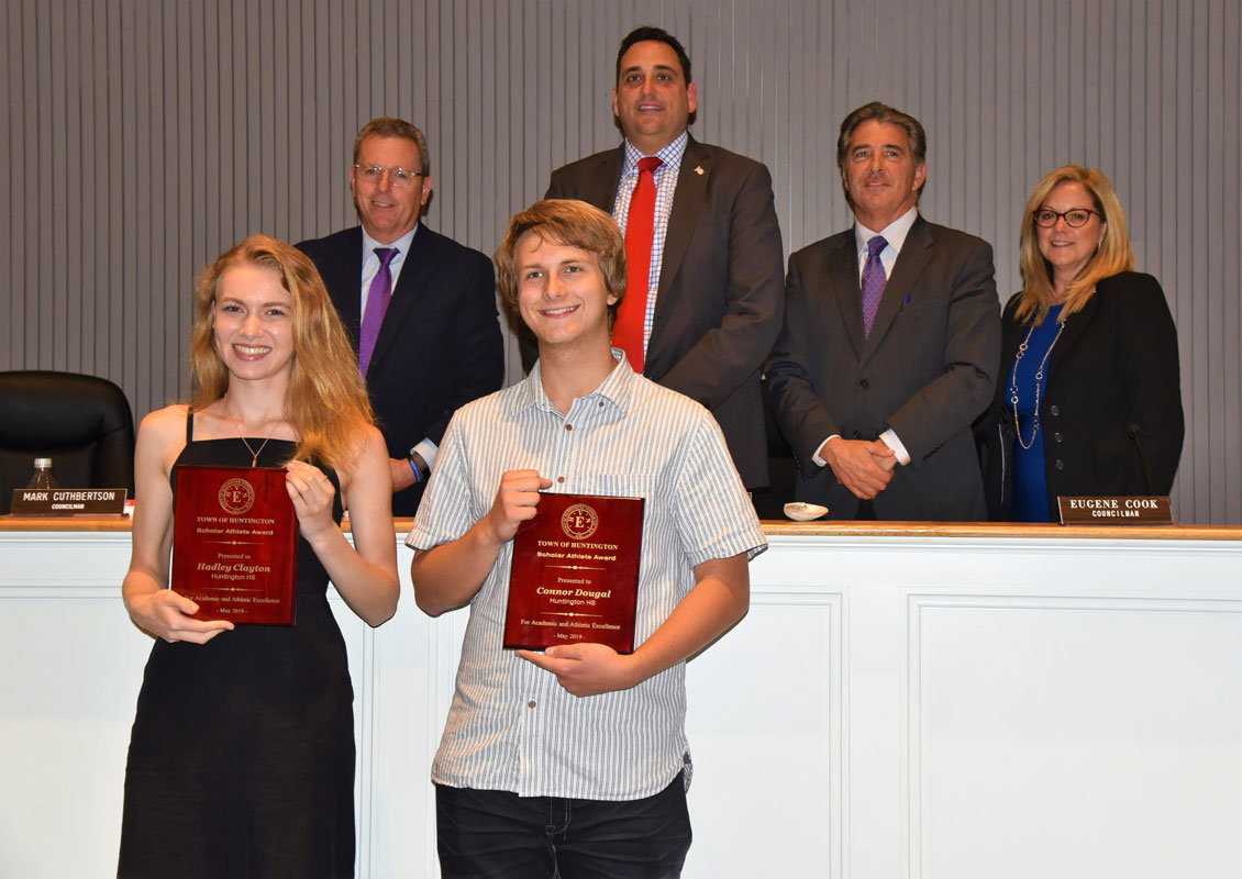 Huntington seniors Hadley Clayton and Connor Dougal with the Town Board.