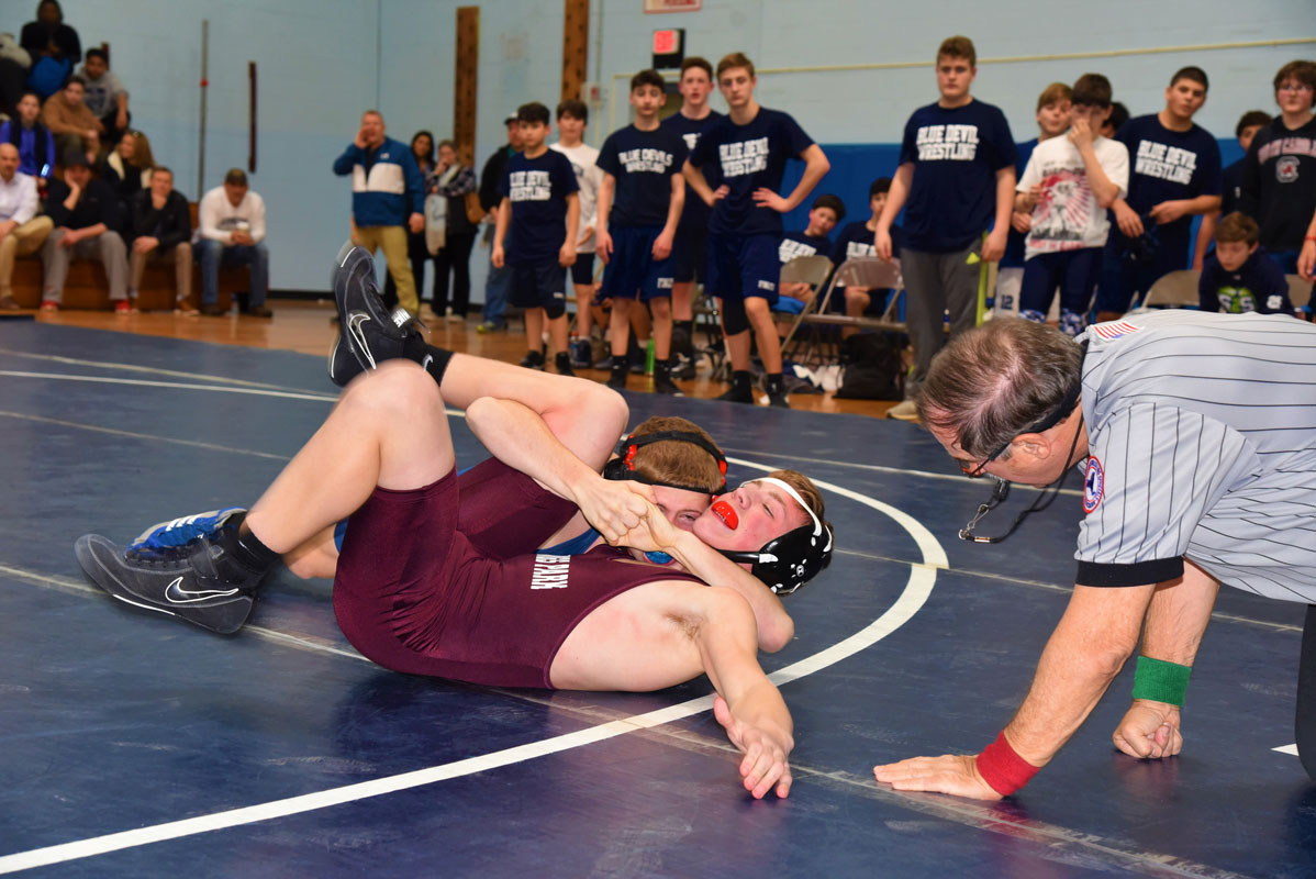 Christian St. John has another opponent all locked up in a tight cradle. 