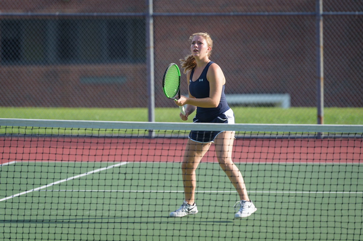 Cameron Fehrs at the net for Huntington girls' tennis. (Darin Reed photo.)