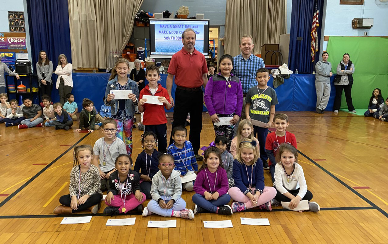 Principal Scott Oshrin (right) and Howard Quinn with Southdown Splash Award recipients.