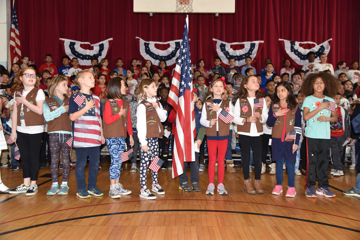 A delegation of Boy Scouts and Girl Scouts served as an honor guard and presented the colors 