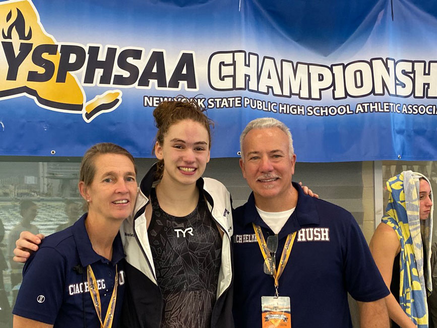 Huntington freshman Kathryn Montefusco flanked by her coaches Meg McConnell and Chris Helmke.