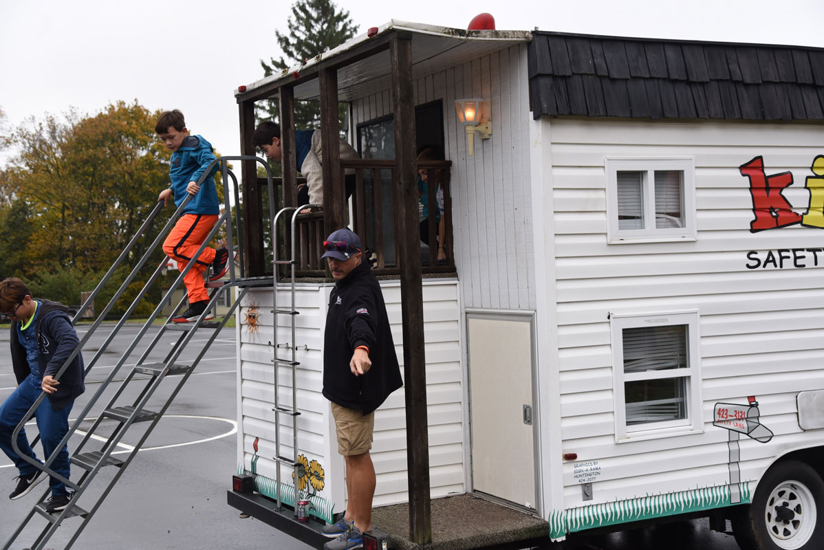 Students learned how to navigate through a smoke-filled house and escape to safety 