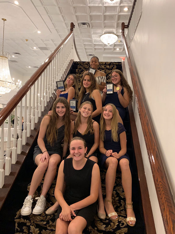 Caitlyn Palermo (right in second from top row) with fellow honorees at Suffolk tennis awards dinner.