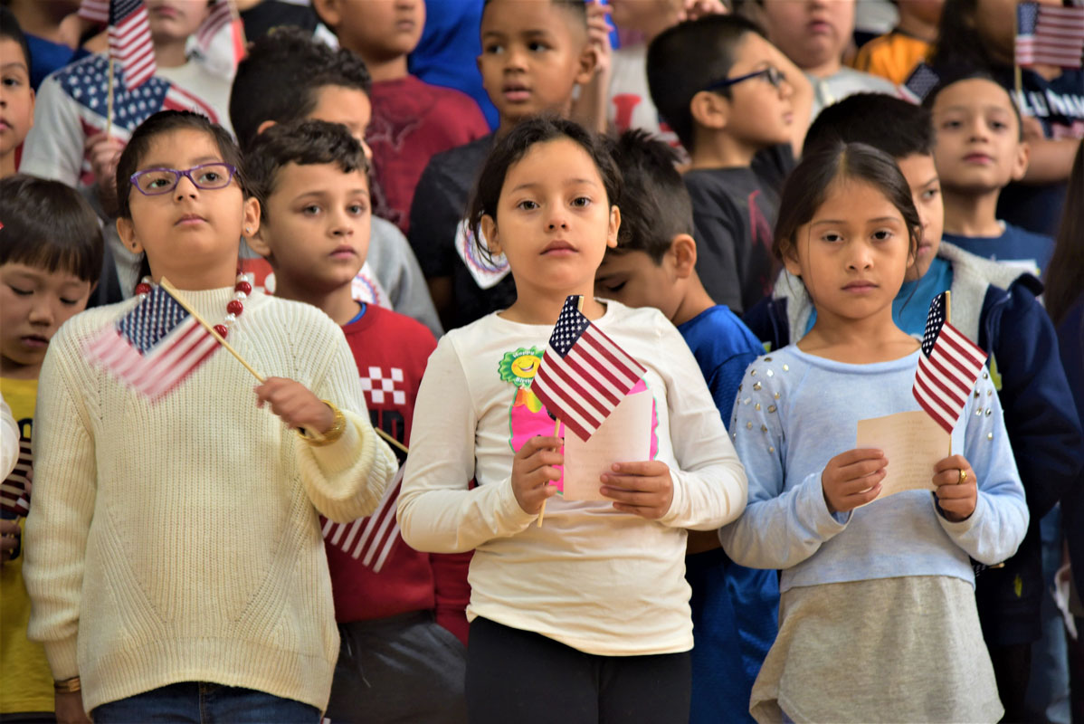 The Washington School students waved small American flags 