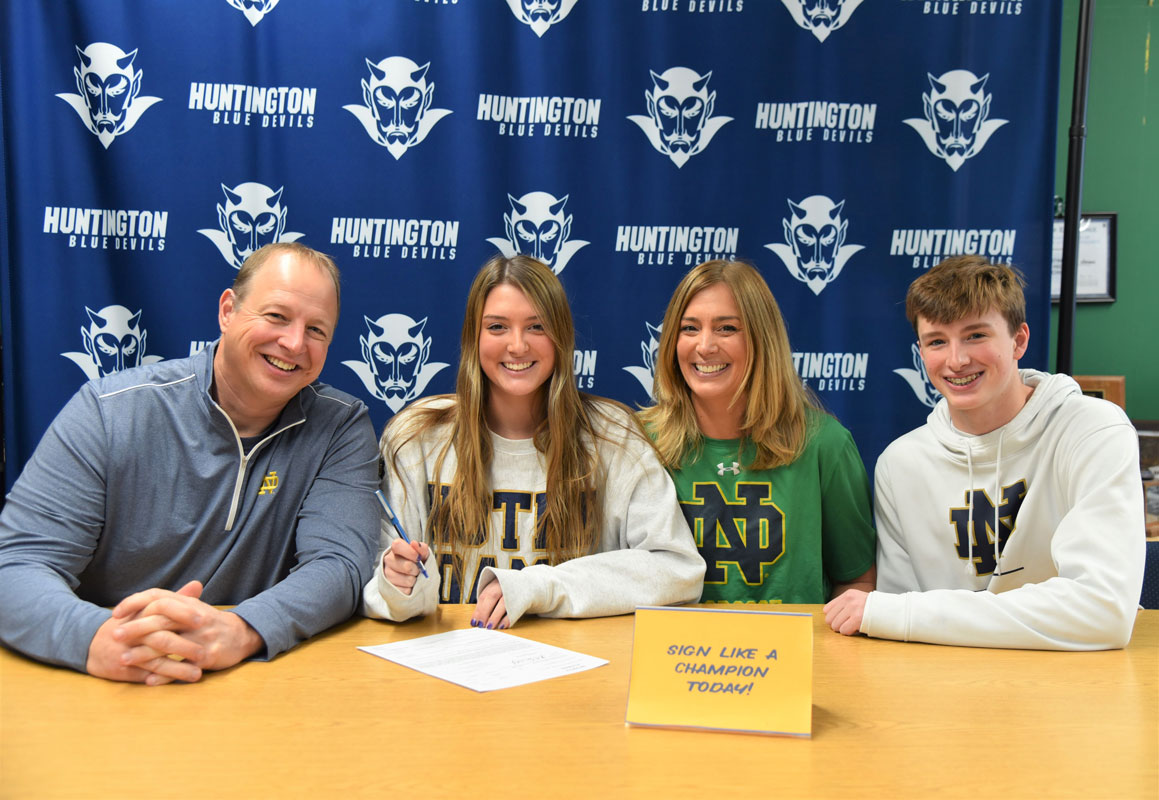 Abby Maichin signed an NCAA Division I letter of intent while surrounded by her family members.  