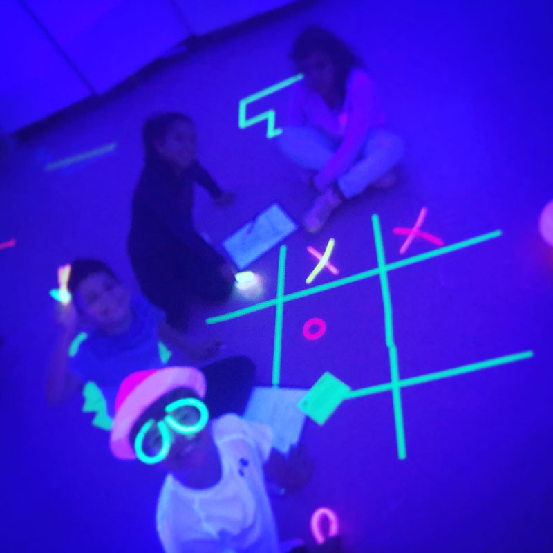 A group of Flower Hill School students enjoyed a glow in the dark room transformation 