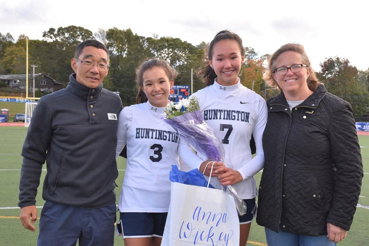 Anna Wickey and her parents and sister on Huntington field hockey Senior Day.