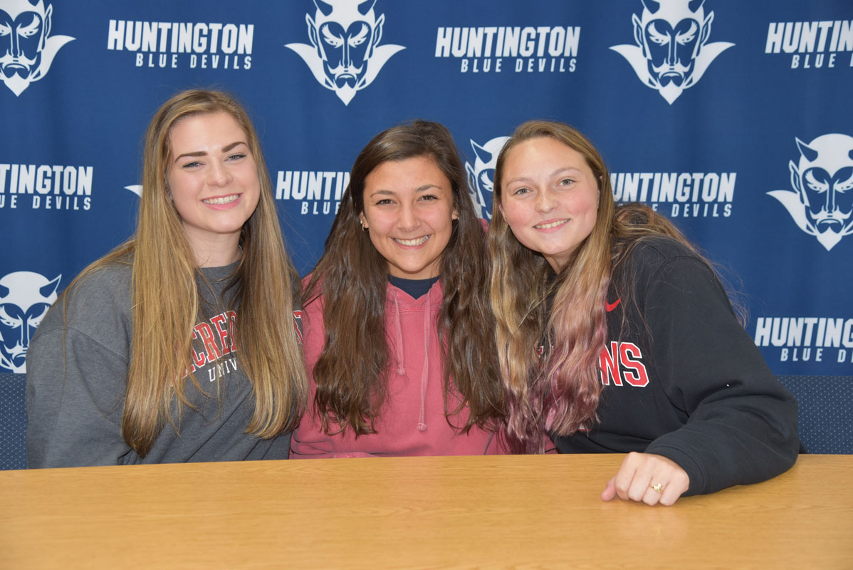 Caroline Hartough (right) with close friends Megan Agrillo and Lena Annunziata on signing day 