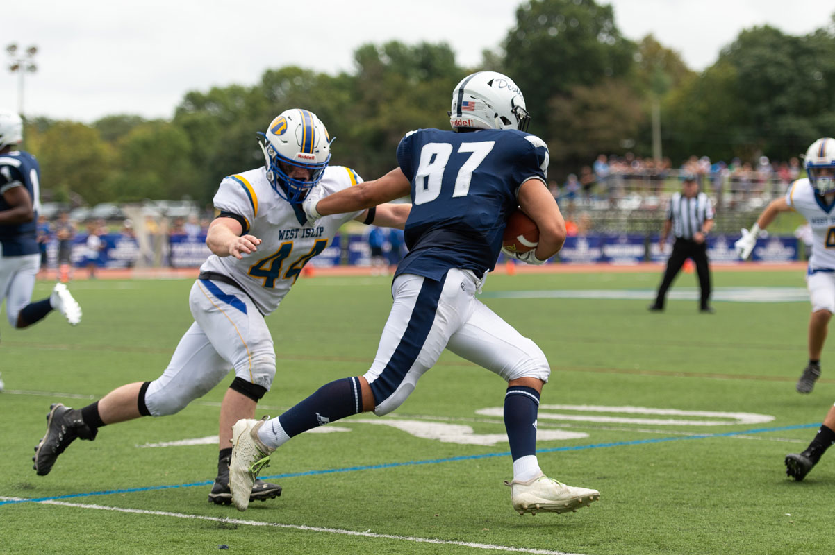 Jon Koumas has the ball as he tries to evade the defense. (Darin Reed photo)