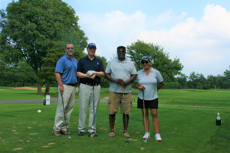Supt. Jim Polansky, Principal Brenden Cusack, Kevin Thorbourne and Trustee Michele Kustera played at Crab Meadow.