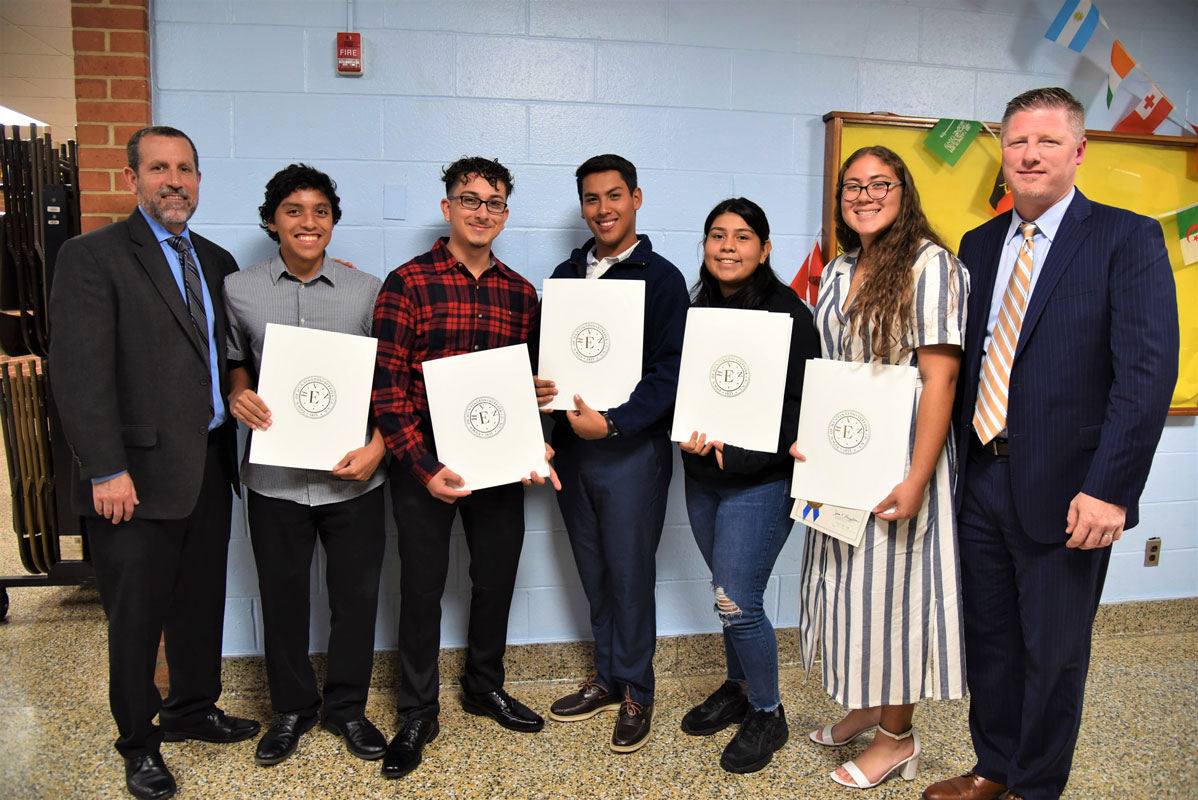 Superintendent Jim Polansky and Principal Brenden Cusack with Hispanic Student Achievement Award recipients 