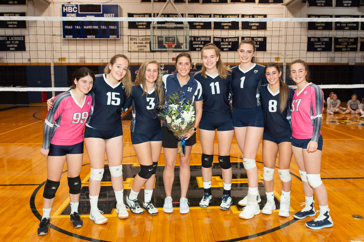 Coach Lauren Visbal is flanked by the Blue Devil seniors on their special night. (Darin Reed photo.)