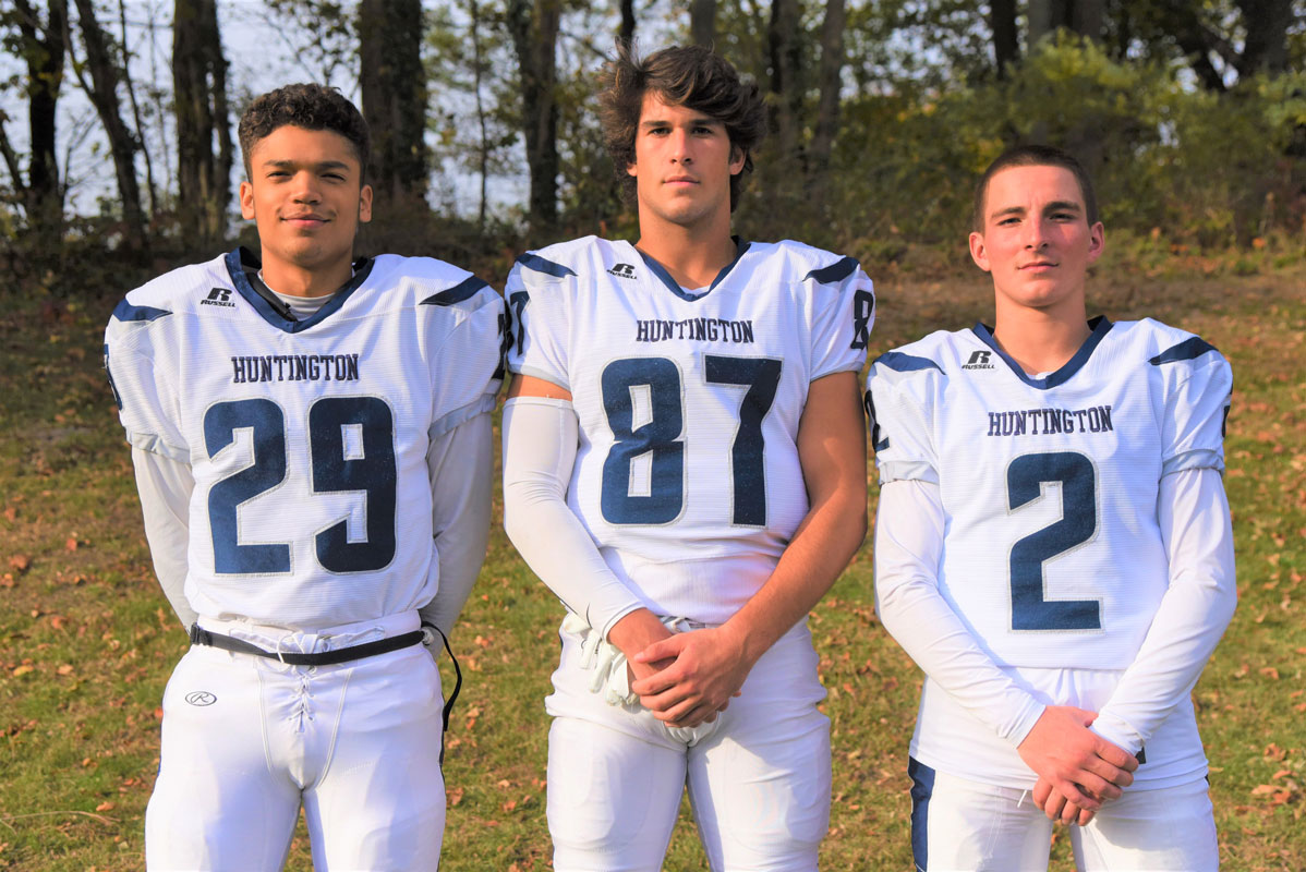Huntington varsity football captains Lex Colato, Jon Koumas and Aedan McDonald.