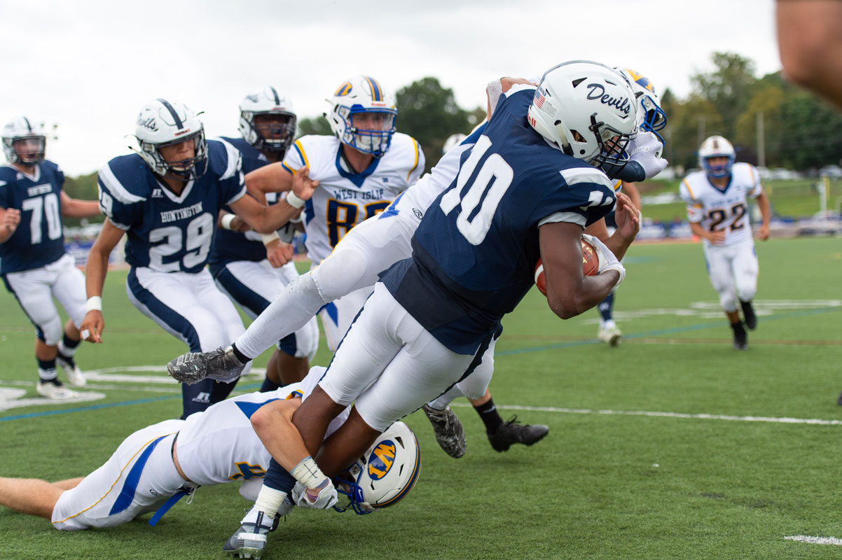 Jaylen Bush dives for extra yardage against West Islip in September. (Darin Reed photo.)