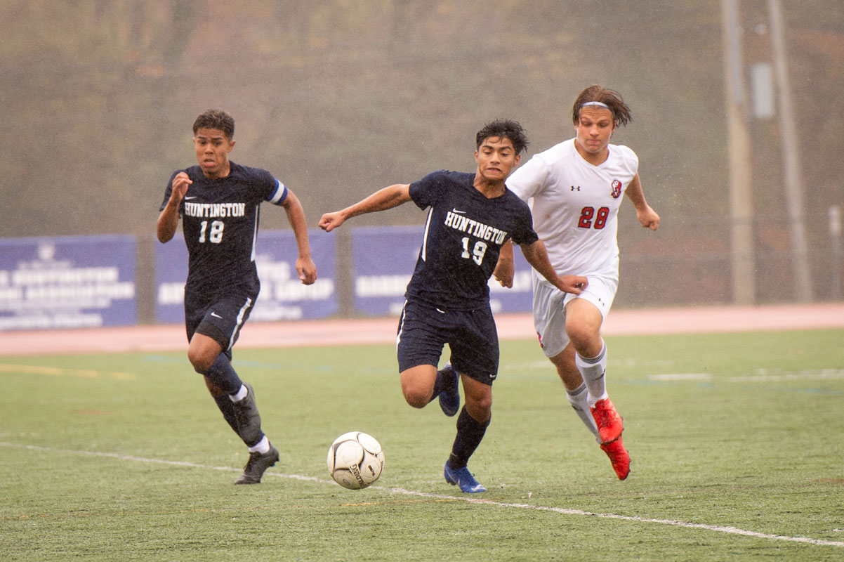 Carlos Reyes (No. 19) sprints after the ball against East Islip. (Darin Reed photo)