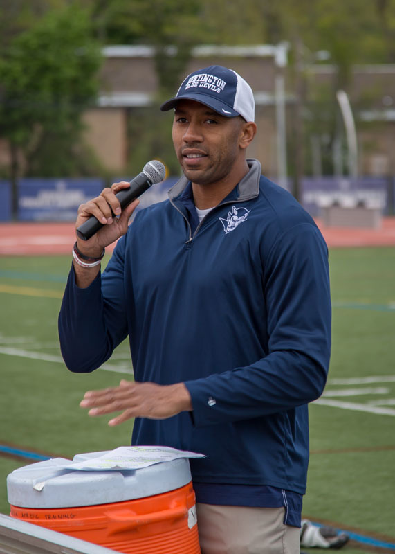 Woodhull School Dean of Students Julian Watts coaches the varsity boys' lacrosse team. (Mike Connell photo.)