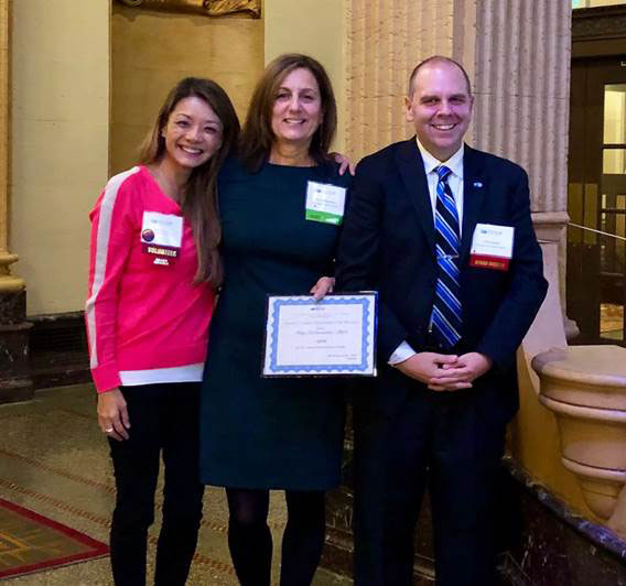Mary DiBenedetto with New York State Assn. of School Psychologists officials at a state conference in Syracuse last week.