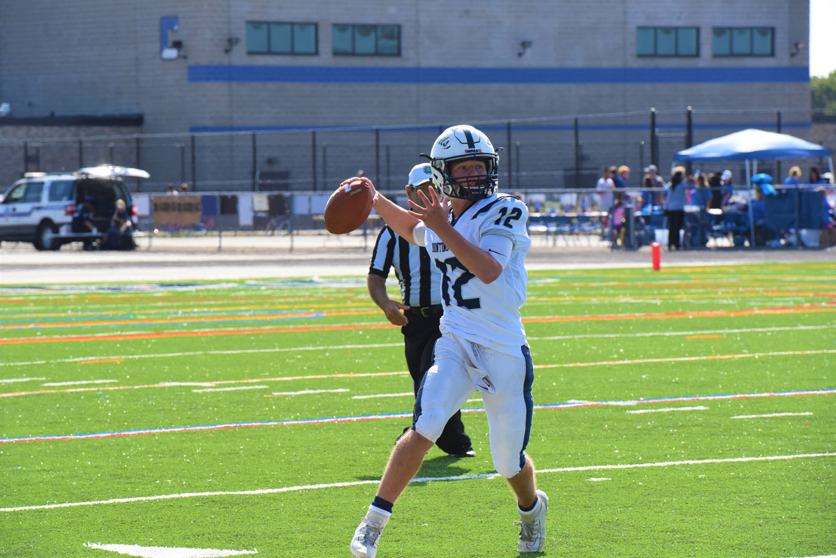 Huntington quarterback Torin Bograd looks for the open man.