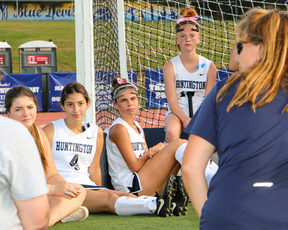Huntington head coach Kathy Wright addresses the team at halftime.