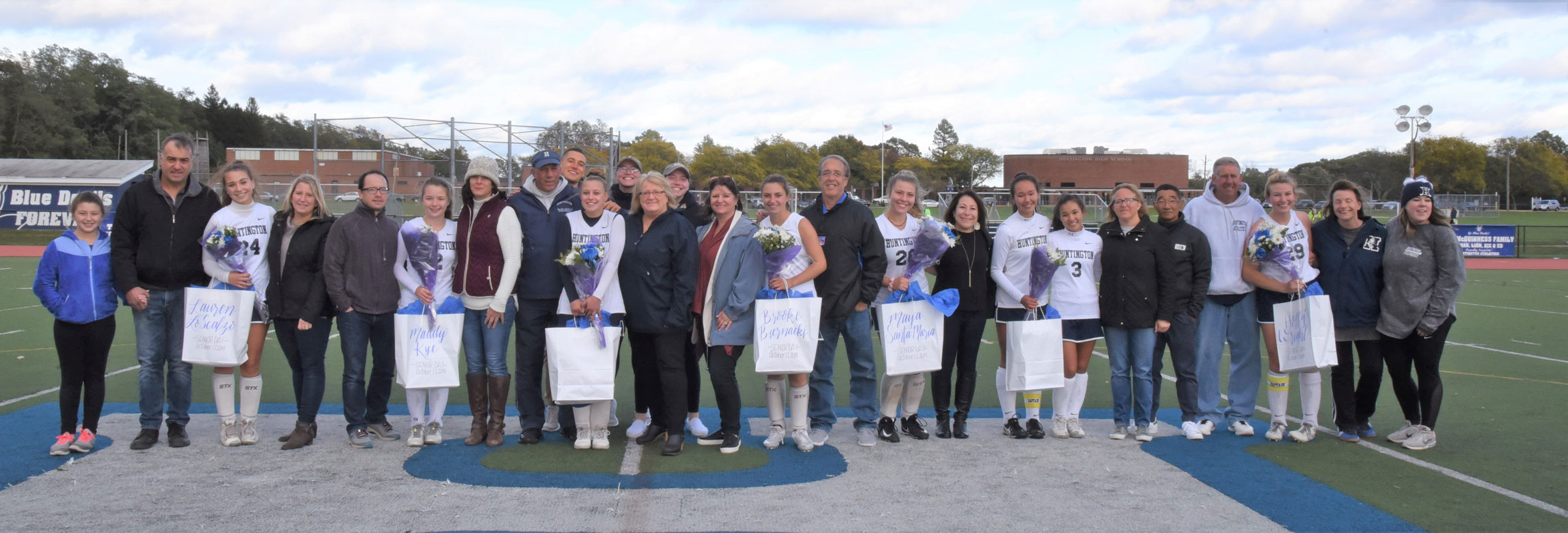The seniors and their parents and coaches on Huntington Field Hockey Senior Day 