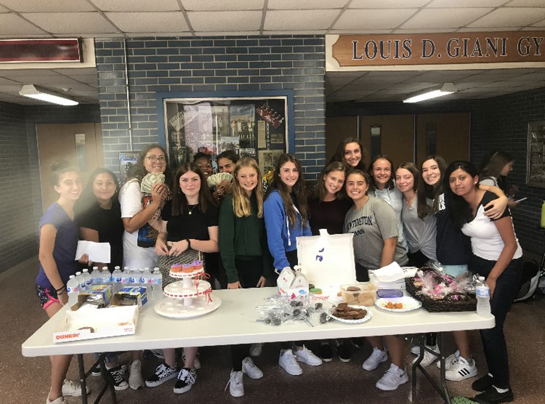 Huntington tennis players held a bake sale to raise funds for the cause..