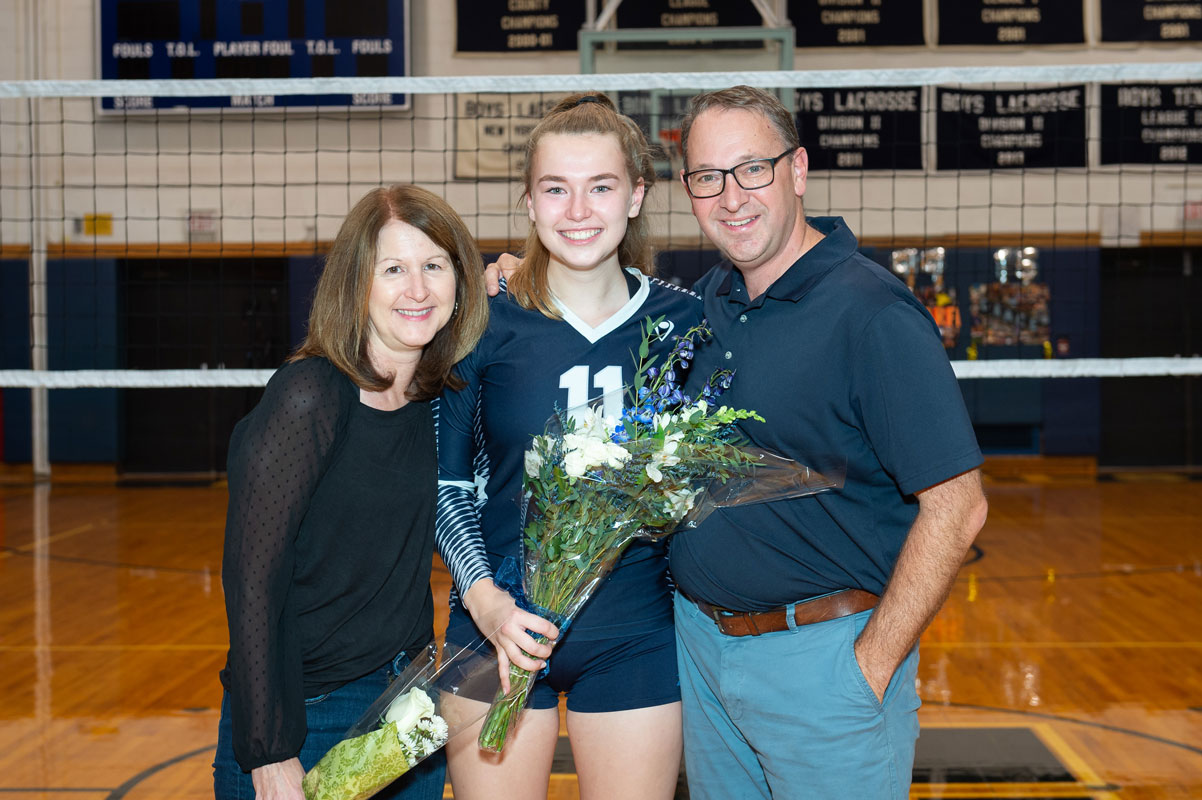 Maddie Reed flanked by her parents, Karen and Darin on Blue Devil girls' volleyball Senior Day.