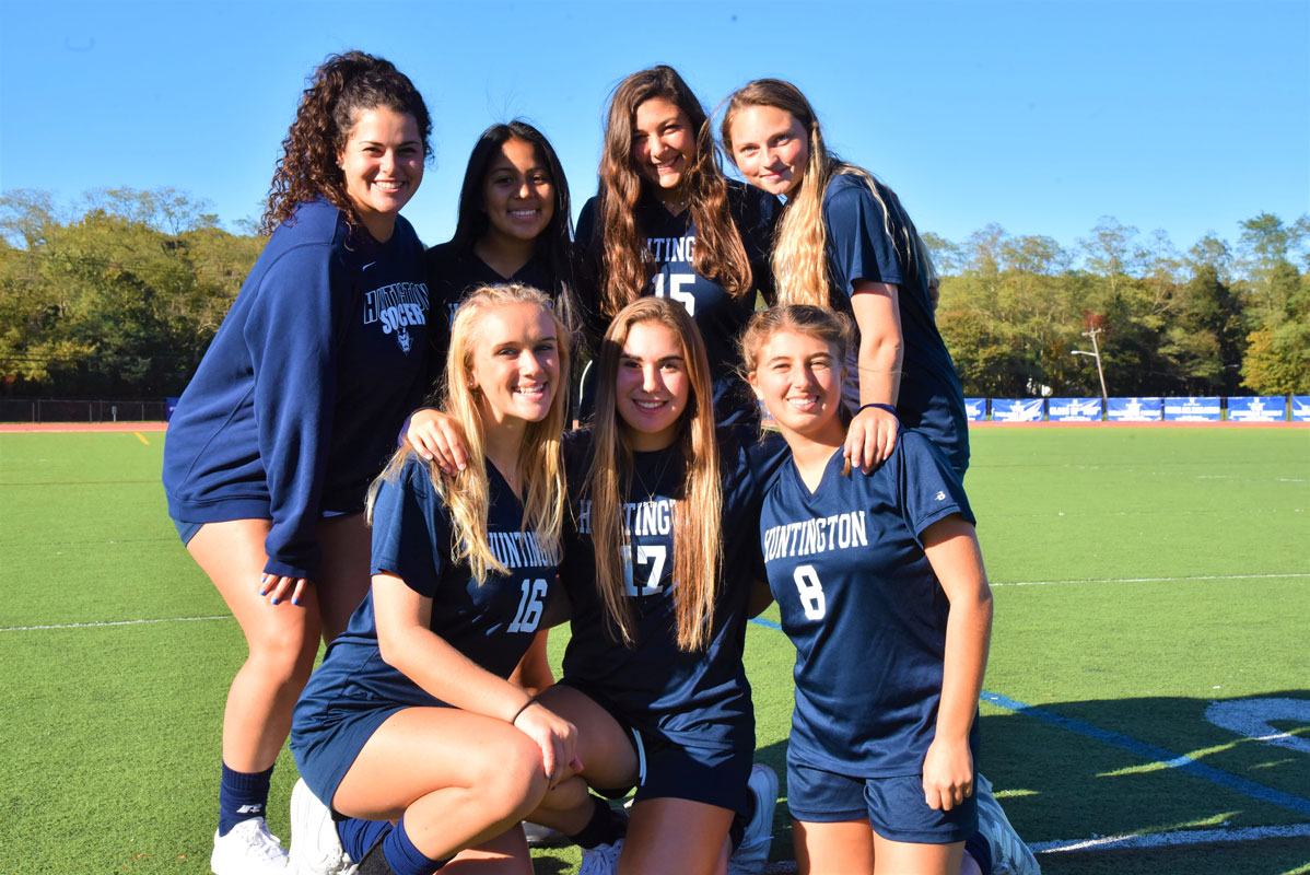The Huntington girls' soccer team's seven magnificent seniors on Senior Day at Blue Devil Stadium 