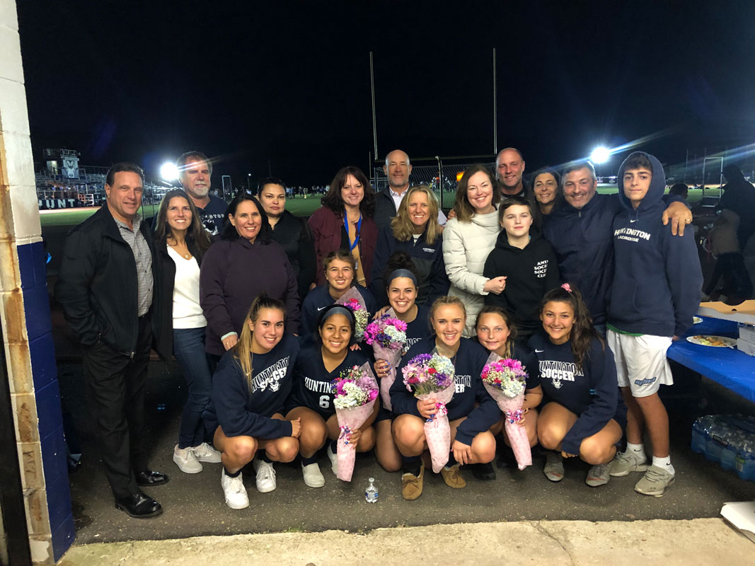 The seven Blue Devil seniors and their parents.