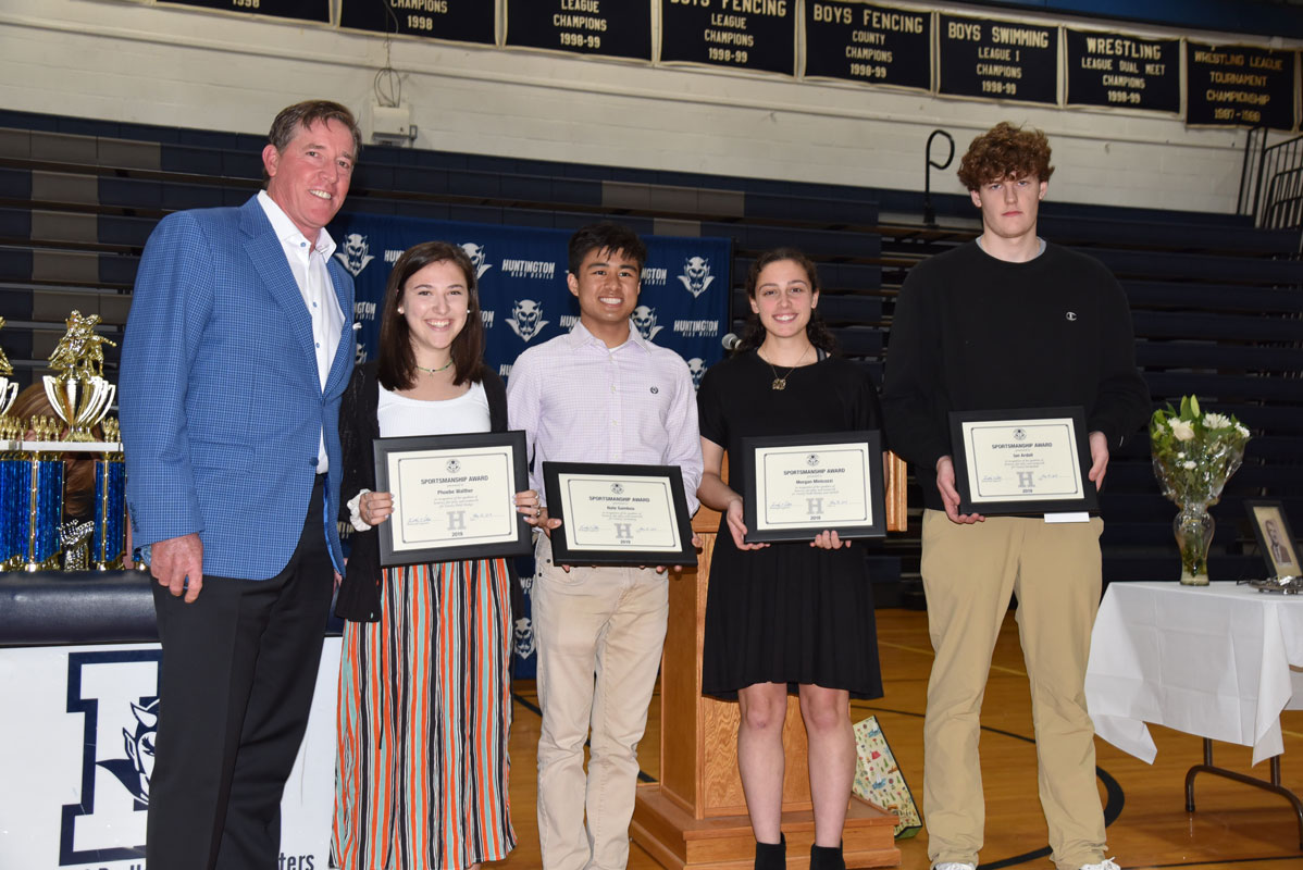 Huntington Booster Club President Tim Pillion with Phoebe Walther, Nate Gamboa, Morgan Minicozzi and Ian Ardell 