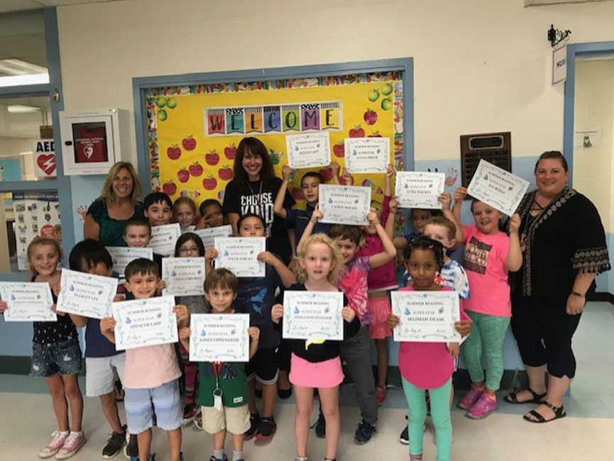 Flower Hill's top summer readers are a very proud group of children.
