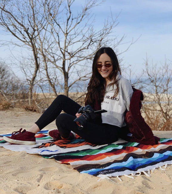 Huntington grad Hailey Treanor takes a break from work on location.