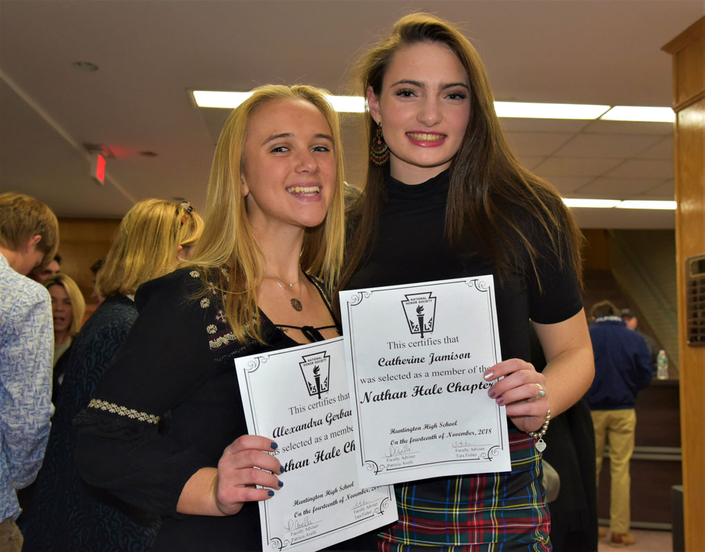Alexandra Gerbavsits and Cat Jamison display their membership certificates last November 