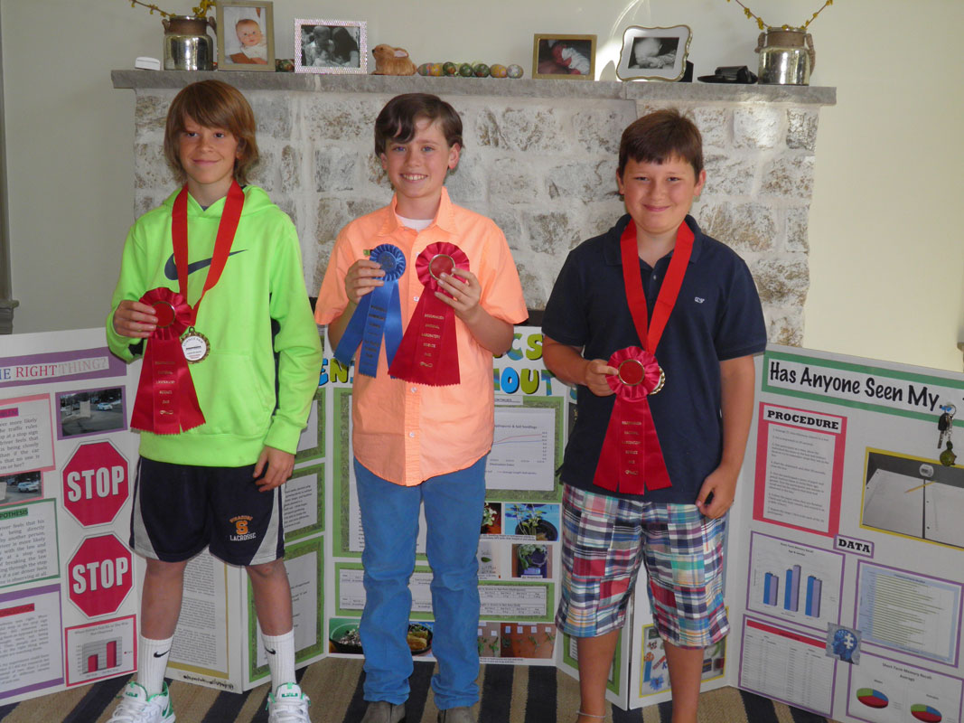 Woodhull sixth graders Cole Pillion, Keenan Lyons and Bryce Vitulli won awards for their science fair projects.
