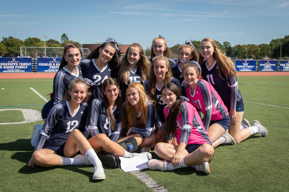 Steli Vlahos (second from left, front) with her volleyball teammates at the recent pep rally. (Darin Reed photo.)