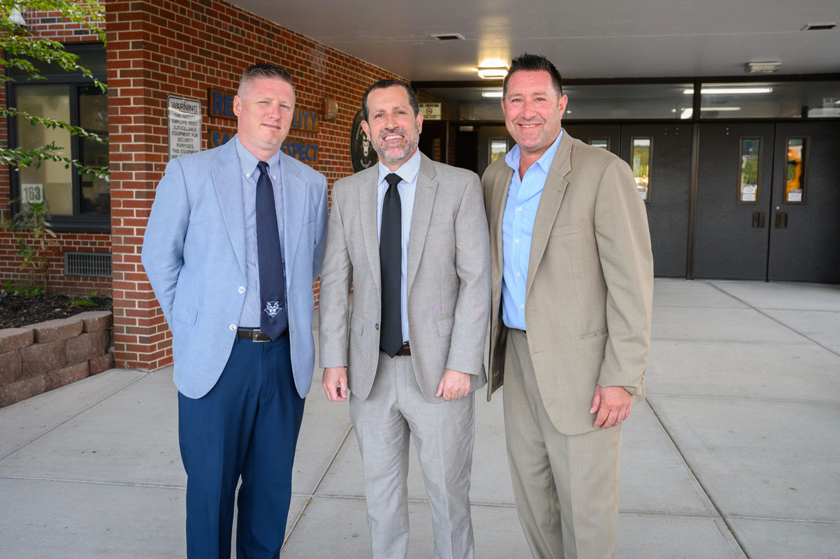 Supt. Jim Polansky is flanked by Huntington High School Principal Brenden Cusack